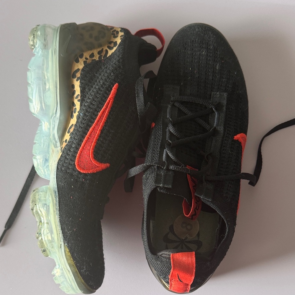 Nike women's Black and Red Athletic Sneakers with leopard